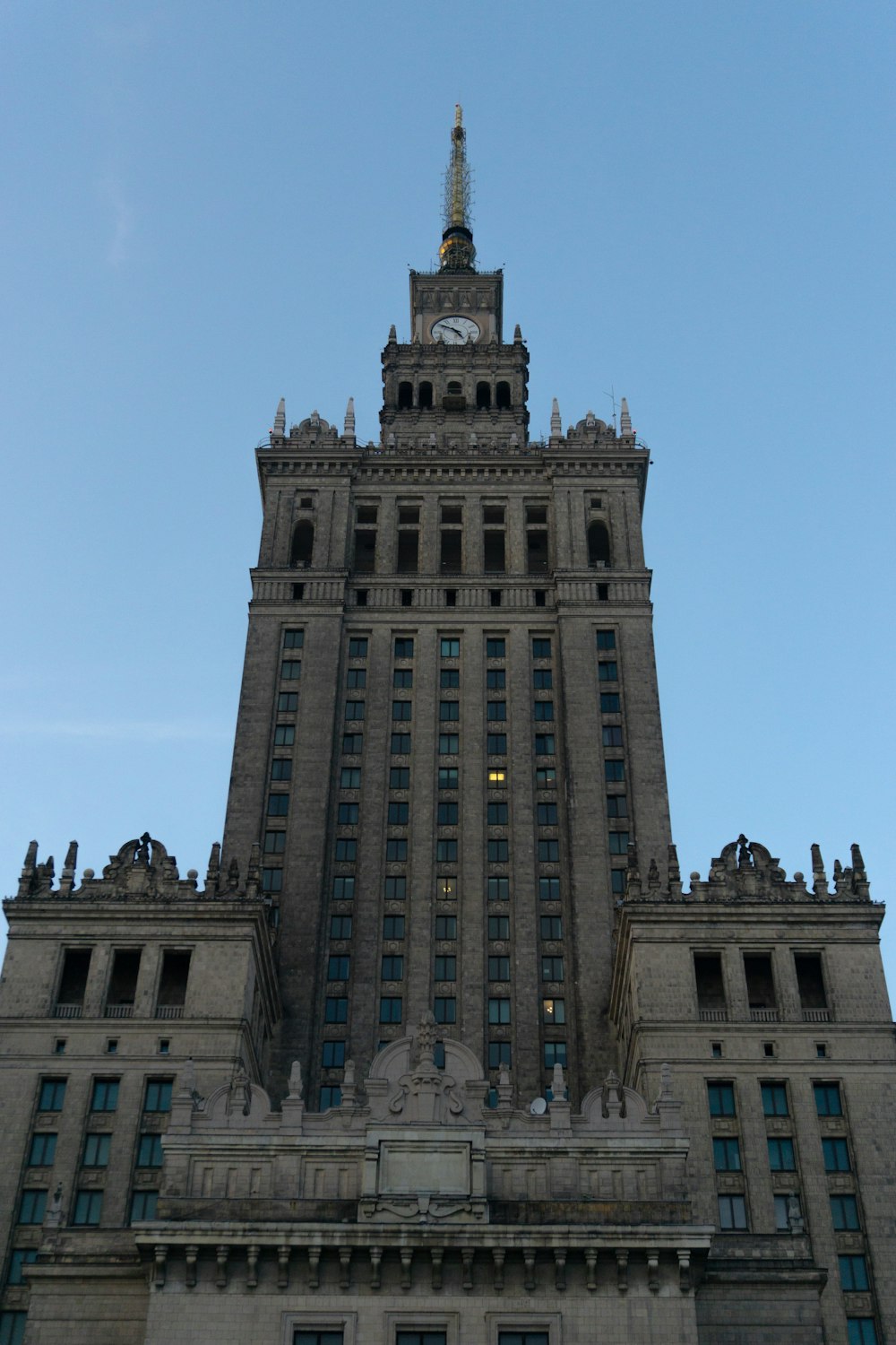 a tall building with a clock on the top of it