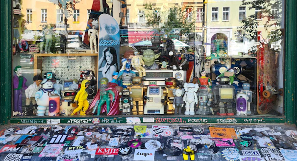 Colorful display of pop culture merchandise including comics, figures, and apparel.