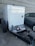 A satisfied customer standing next to a diesel generator from Smart Power Generation.