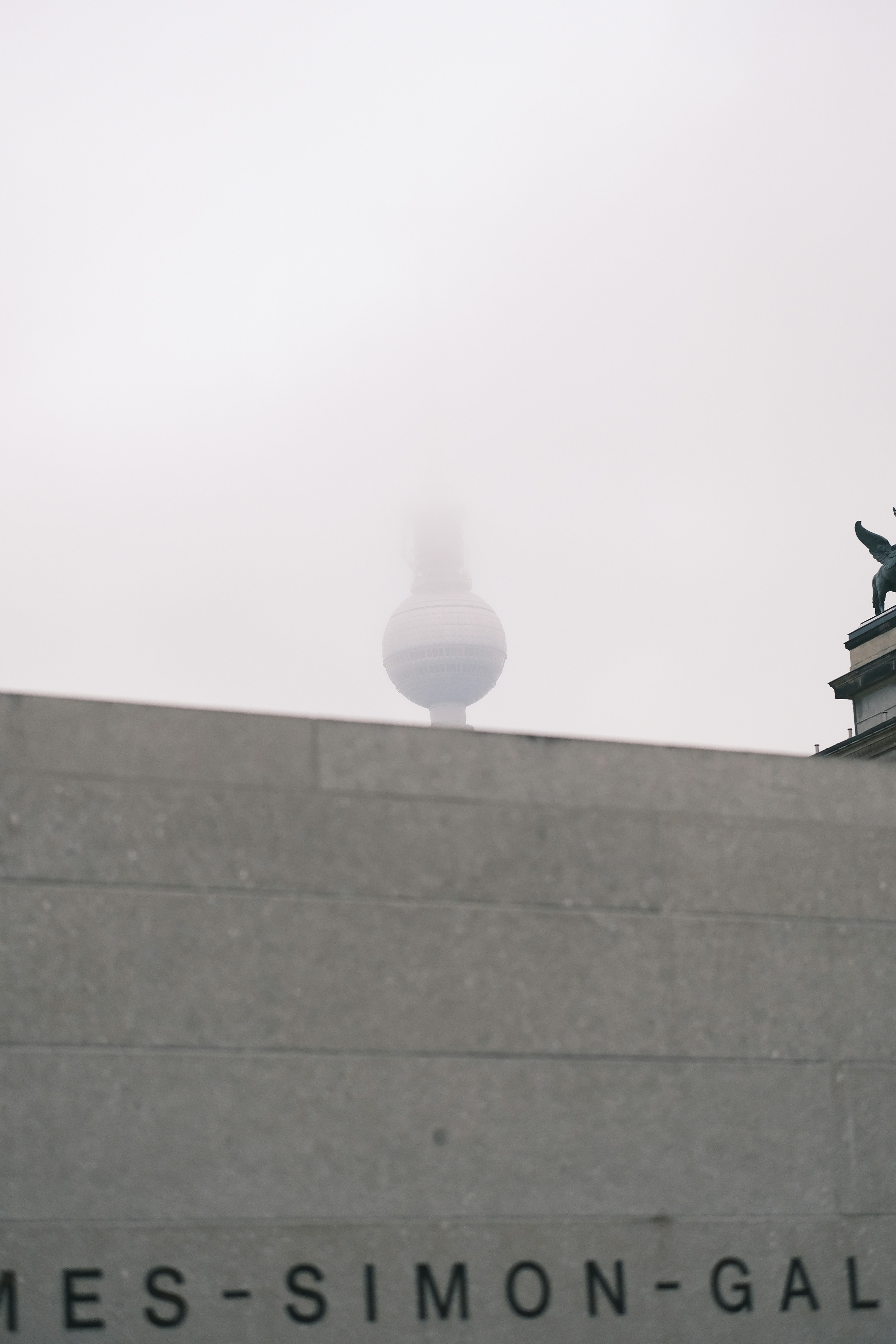 a building with a statue on top of it