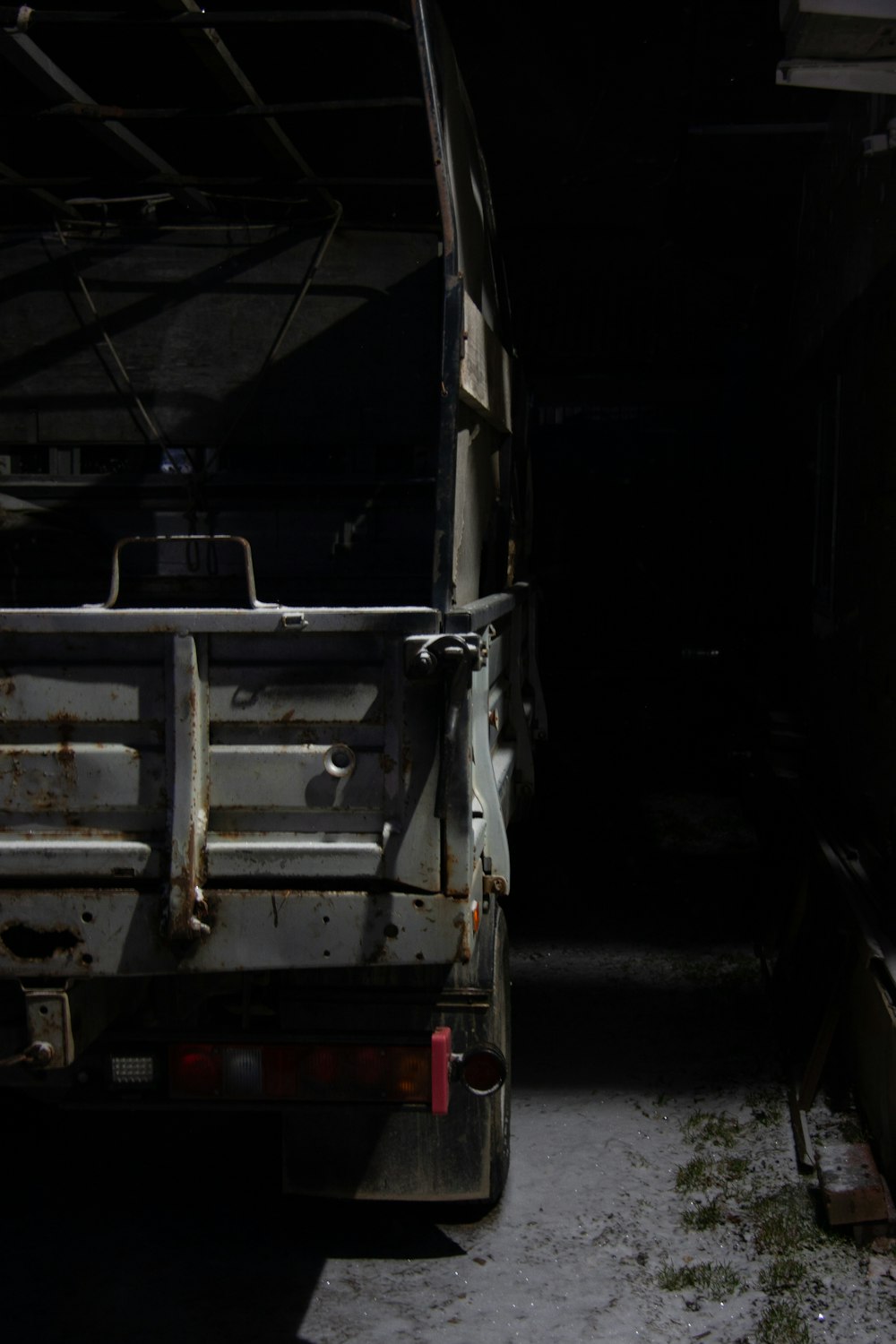 the back of a truck parked in a garage