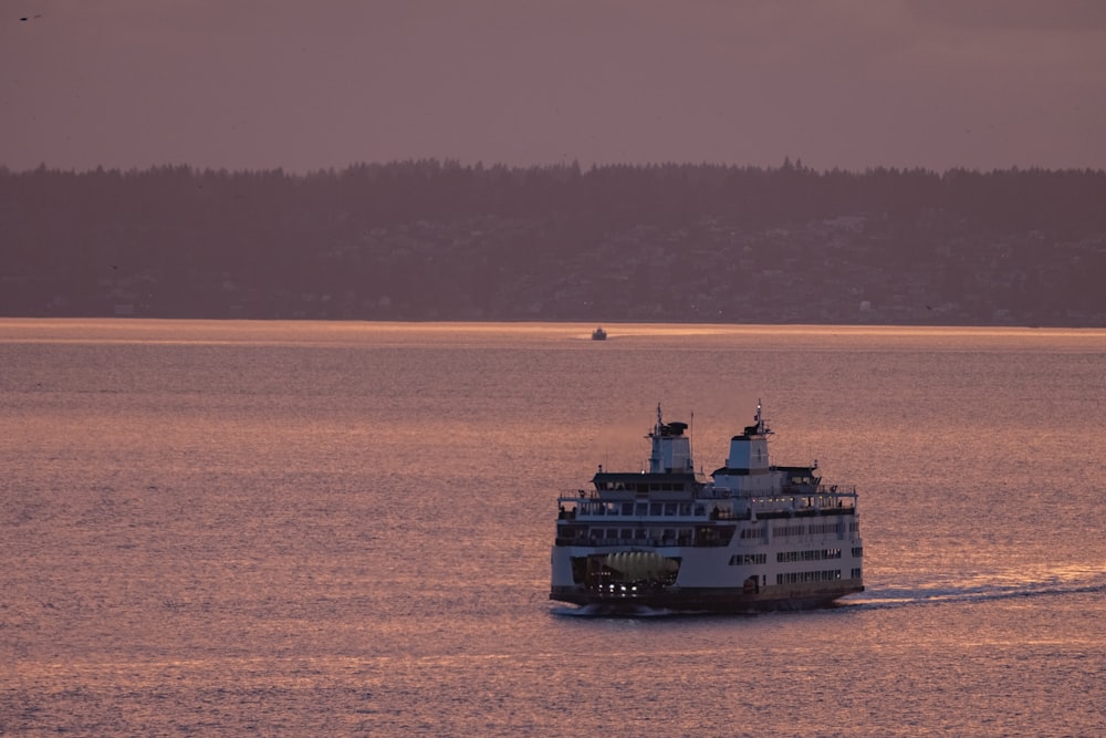 a large boat traveling across a large body of water