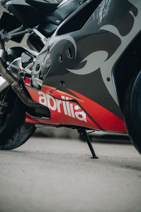 a close up of a motorcycle parked on the street