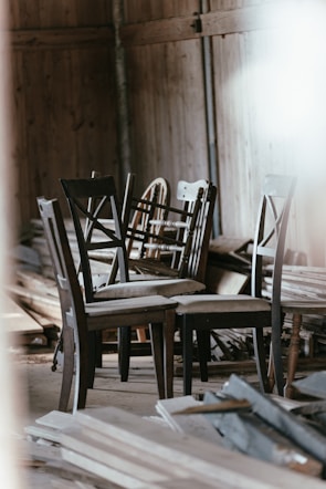 A collection of multwood chairs in various styles.