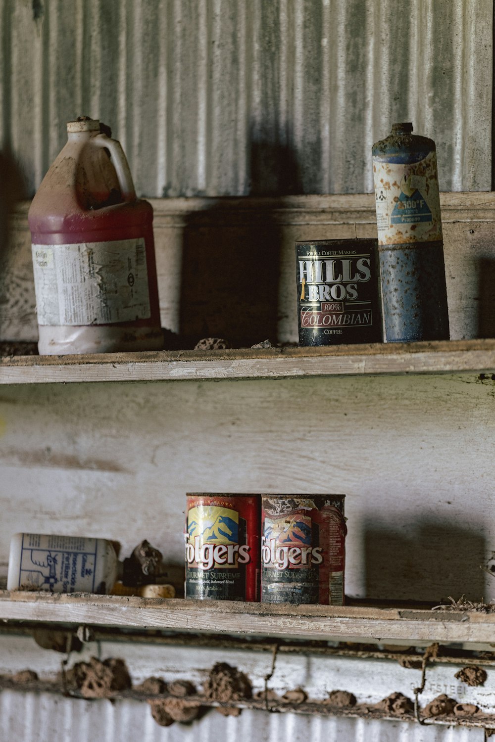 a shelf filled with lots of different types of cans