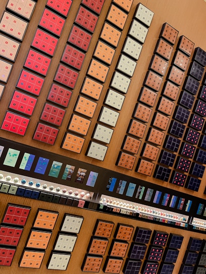 Close-up of a selection of Mokaflor coffee capsules arranged neatly on a wooden counter.