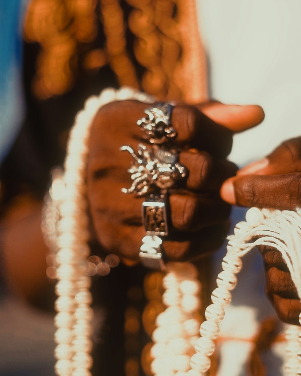 a close up of a person holding a ring