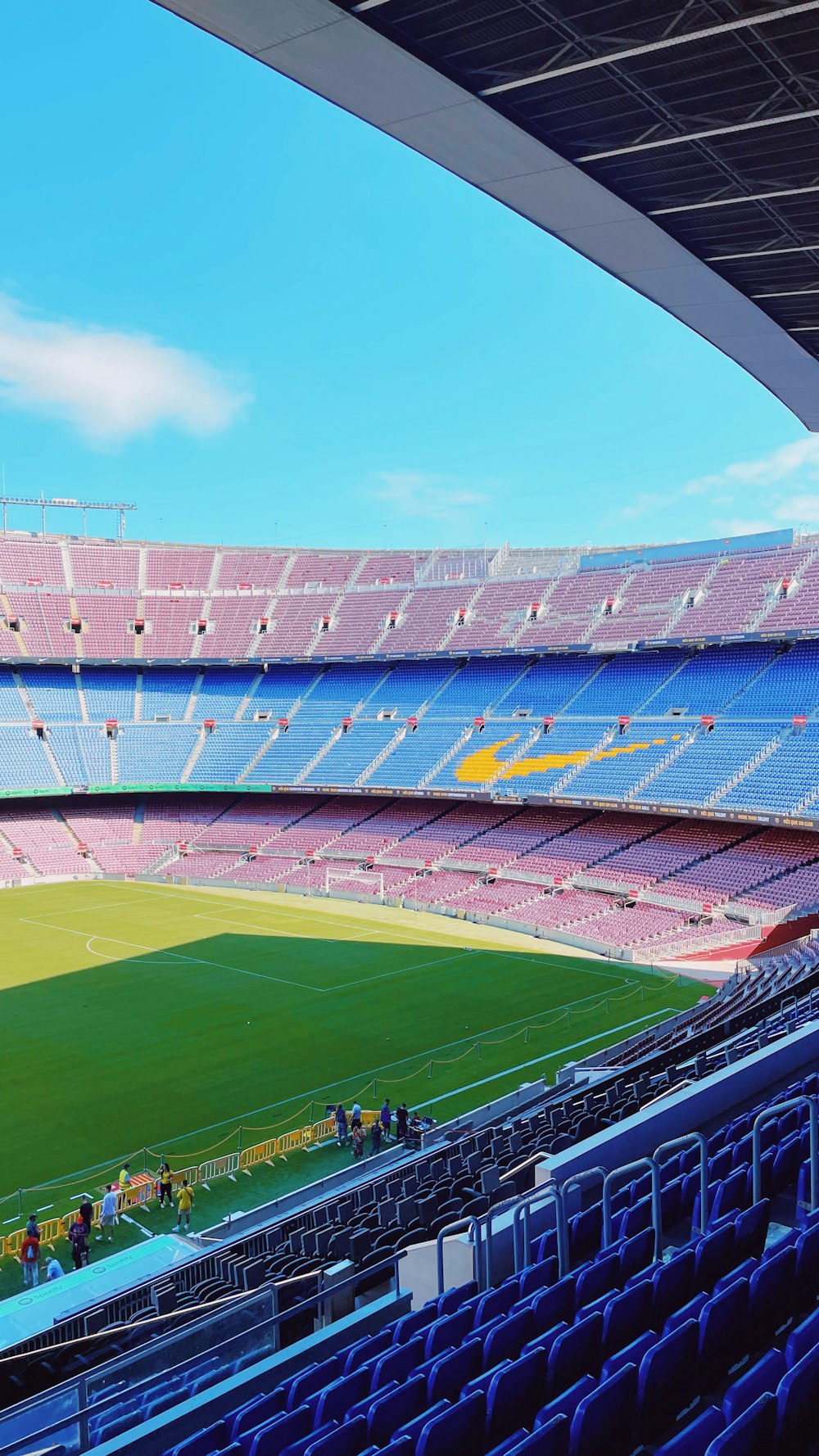 a stadium filled with lots of blue seats