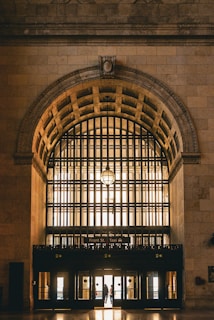 An inviting entrance featuring stylish doors and windows in a bright setting.