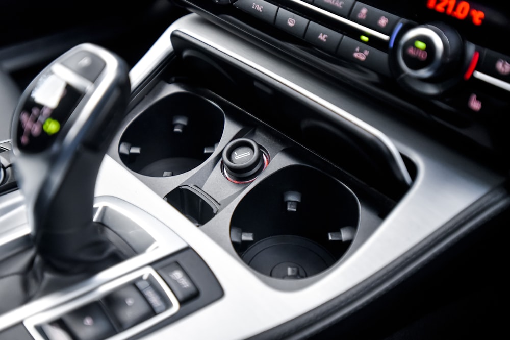 a close up of a car dashboard with a steering wheel