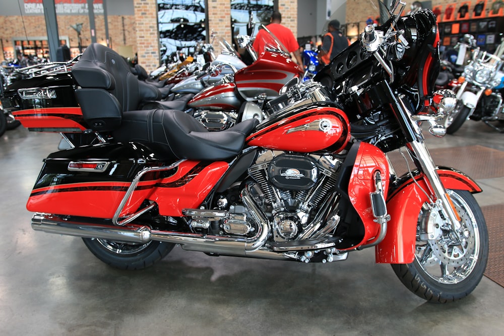 a red motorcycle parked inside of a building