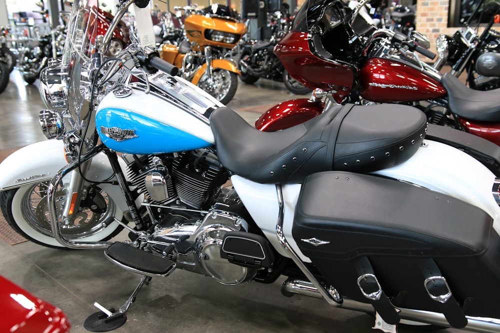 a group of motorcycles are parked in a showroom