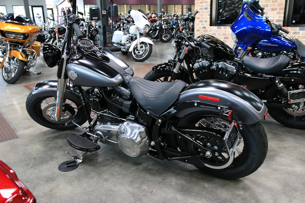 a group of motorcycles are parked in a showroom