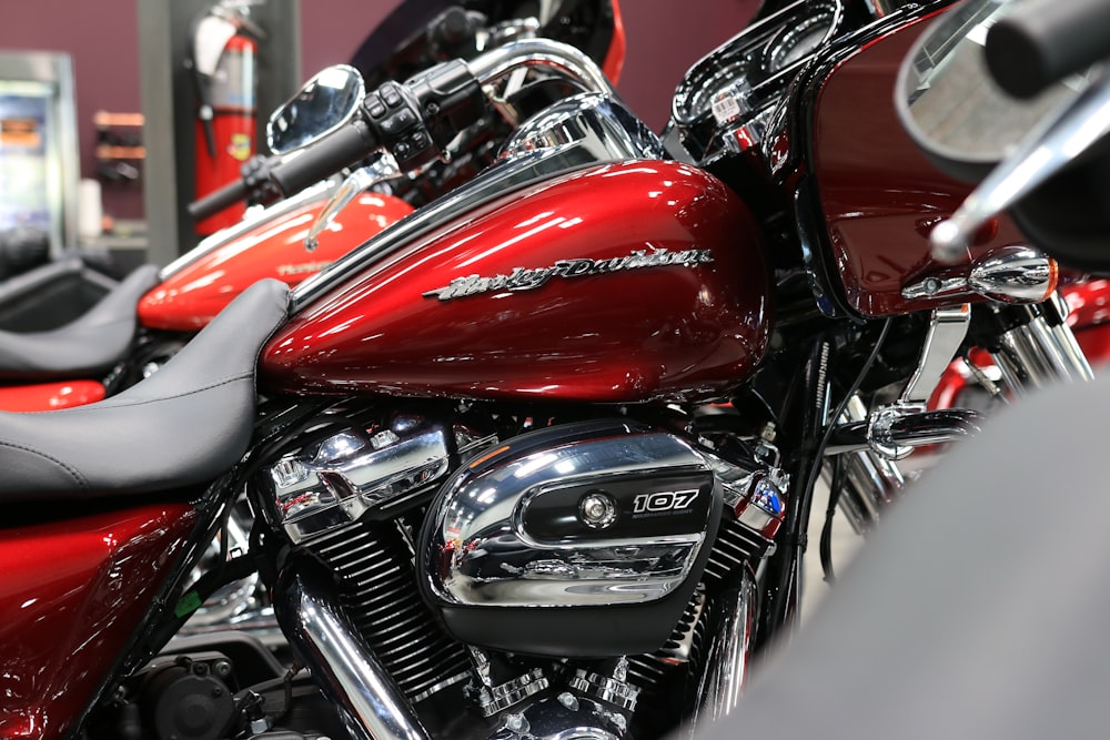 a row of red motorcycles parked next to each other