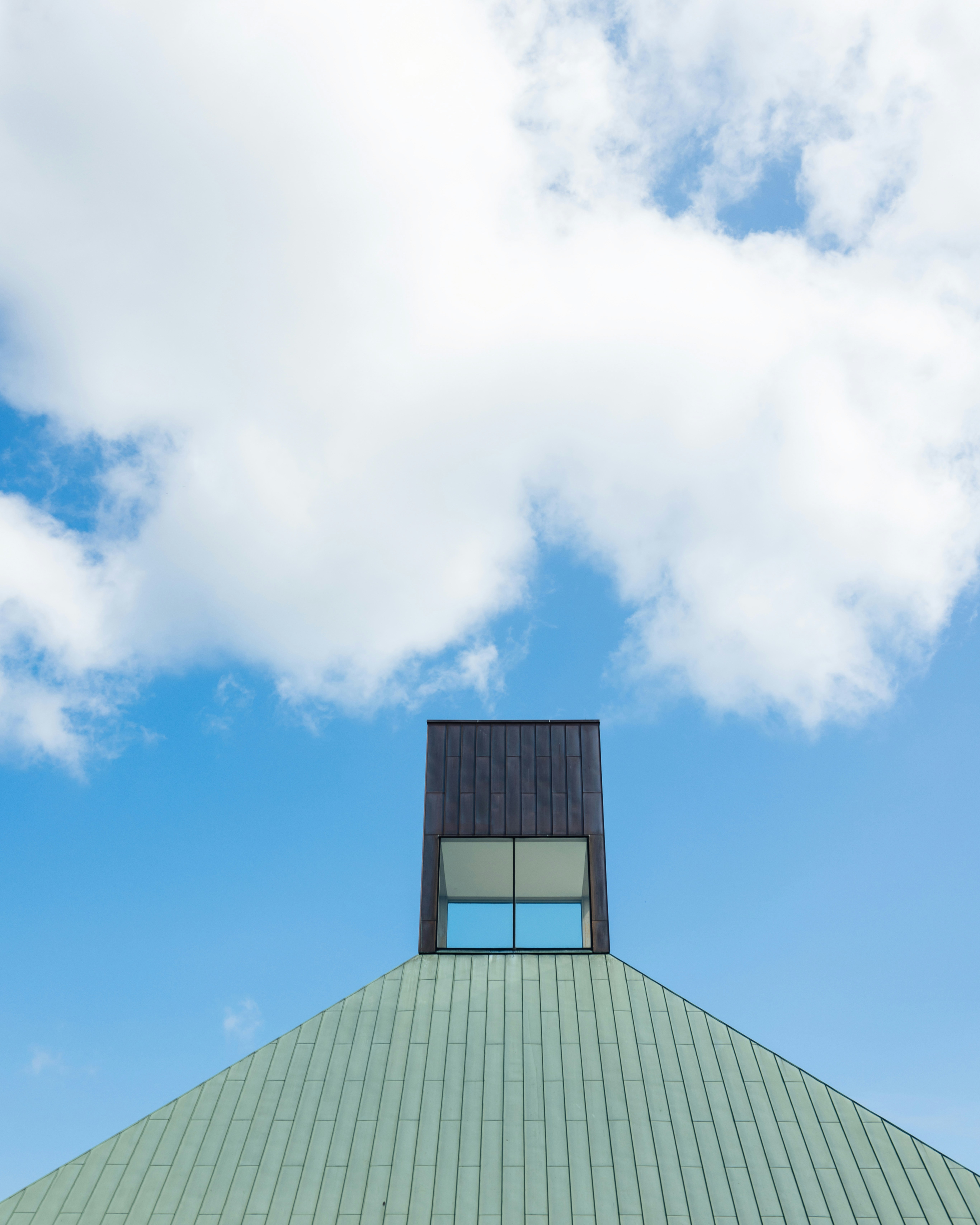 the top of a building with a sky background