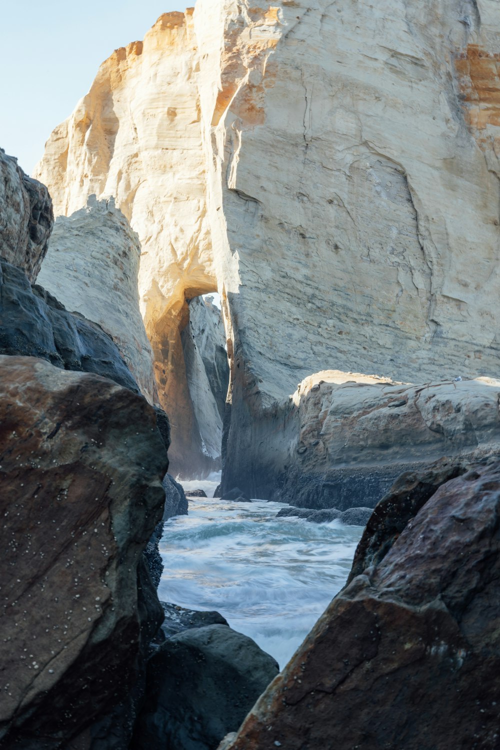 a large rock formation with a cave in the middle of it