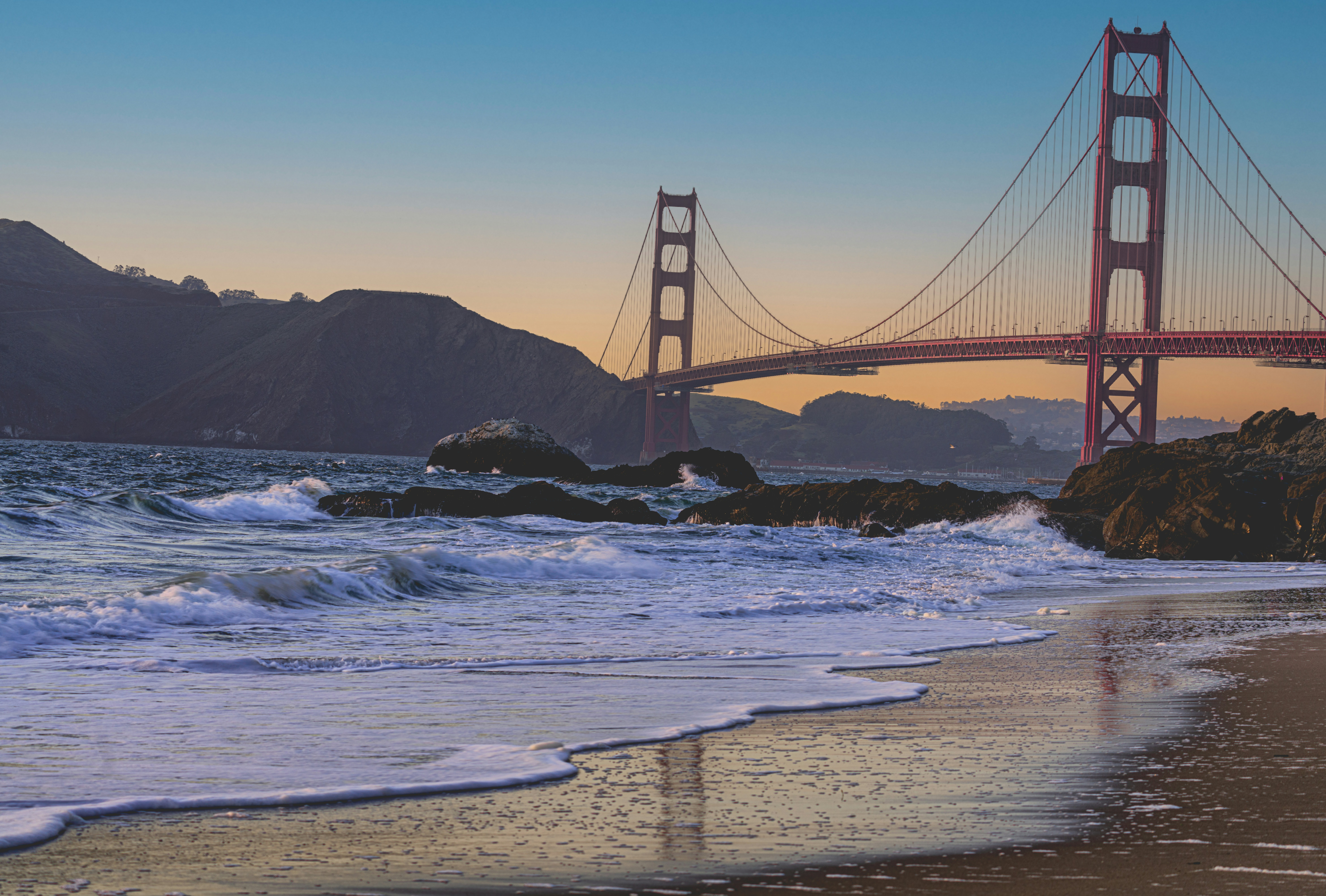 a view of the golden gate bridge from the beach, Golden gate at golden hour