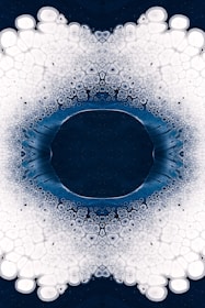 a blue and white circular design with bubbles