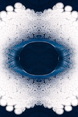A minimalist poster featuring a mandala design with subtle celestial symbols on a white background.