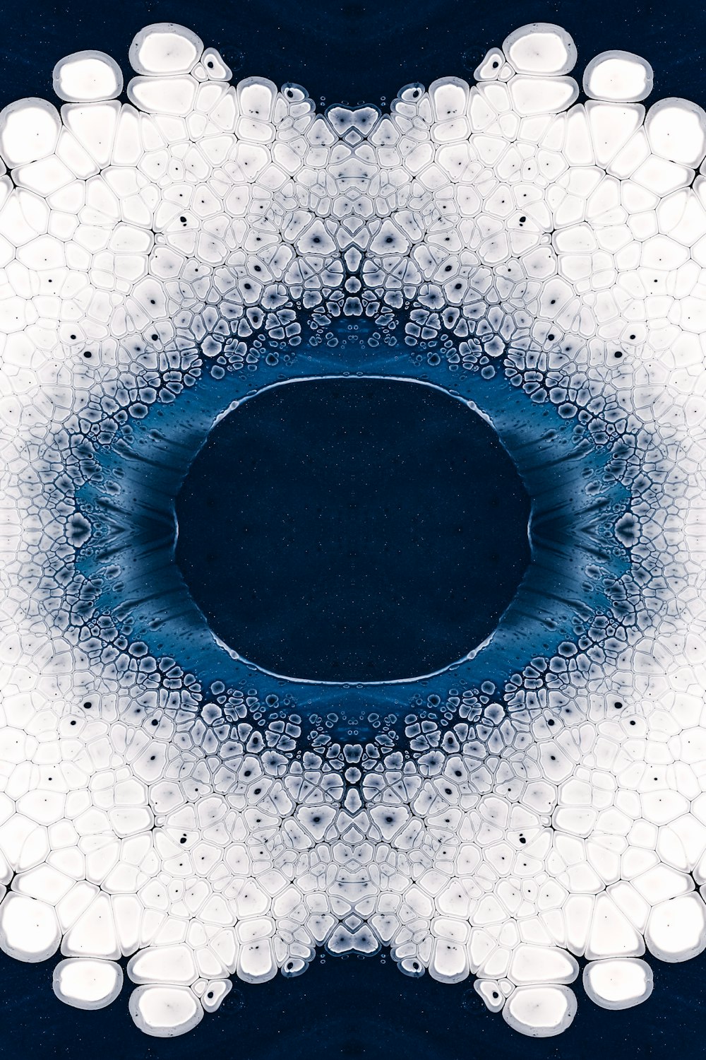 a blue and white circular design with bubbles