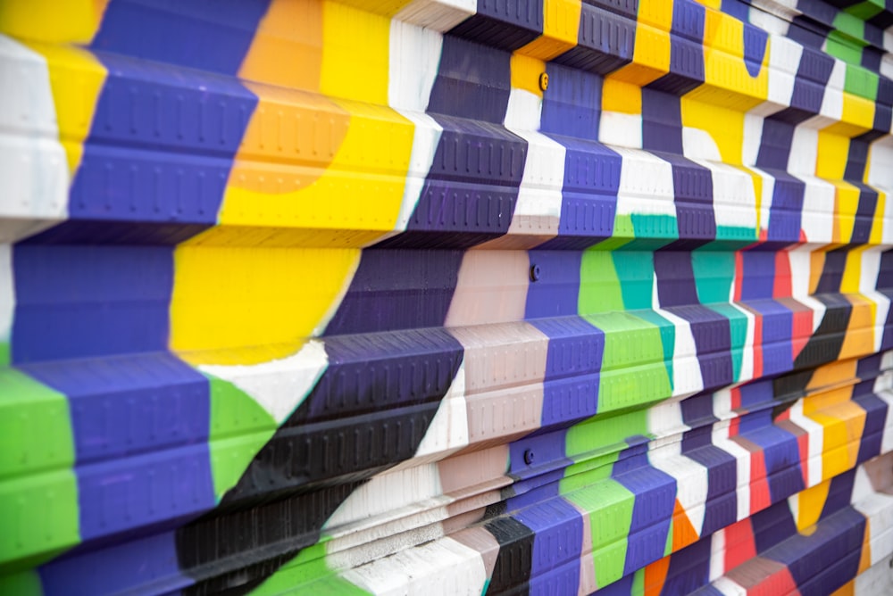 a close up of a row of brightly colored blinds