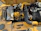 Close-up of a yellow industrial generator running smoothly on a construction site.