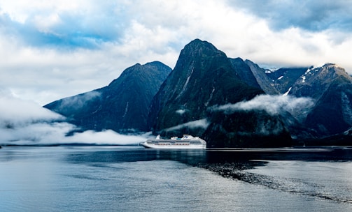 A majestic cruise ship sailing past towering Alaskan glaciers.