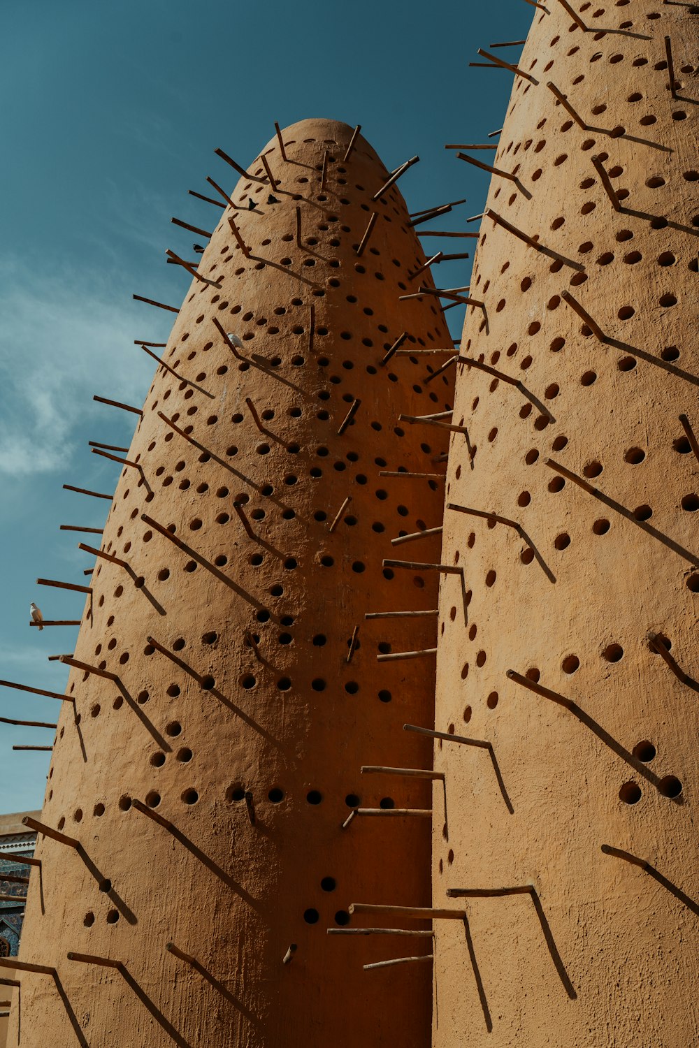 a close up of a building with spikes on it