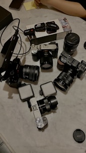 A production studio setup featuring various cameras and lenses ready for use.