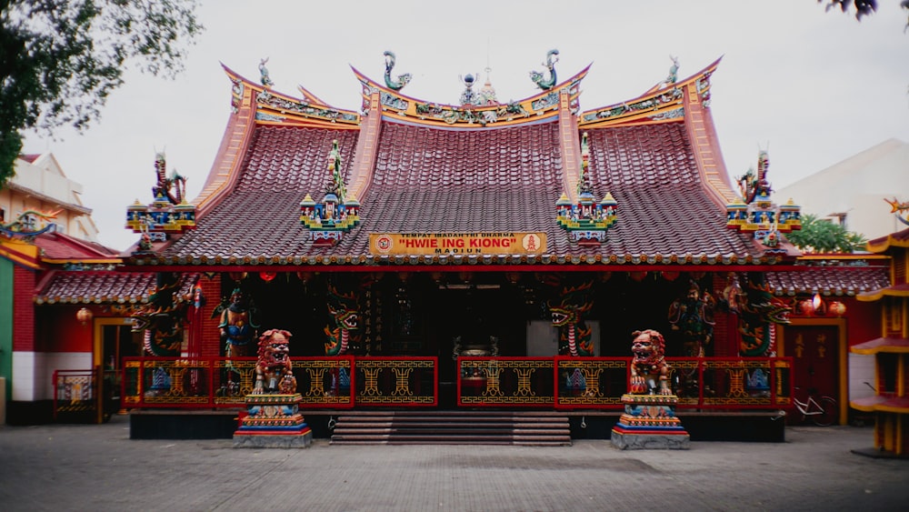 a chinese style building with a red roof