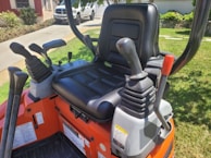 Close-up of the controls inside a 3001.5 model mini excavator.