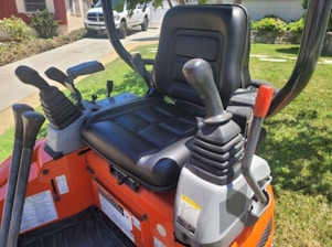 Close-up of heavy-duty construction machinery controls with yellow and black accents.