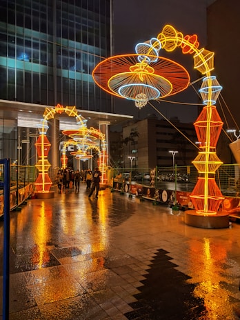 Night view of Lapa arches lit up with lively samba dancers nearby