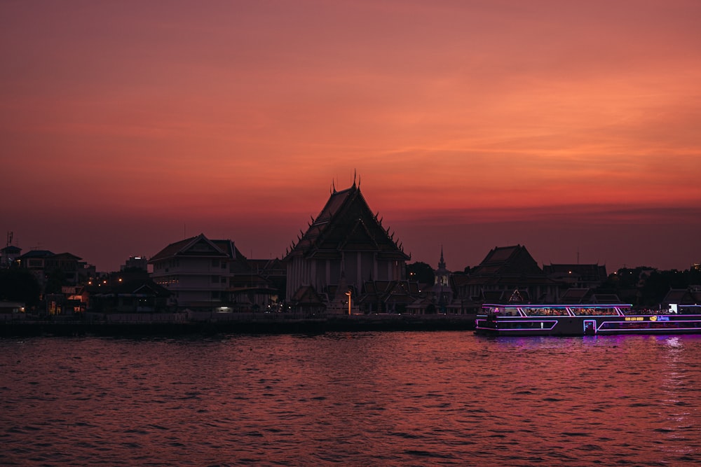 a boat floating on top of a body of water