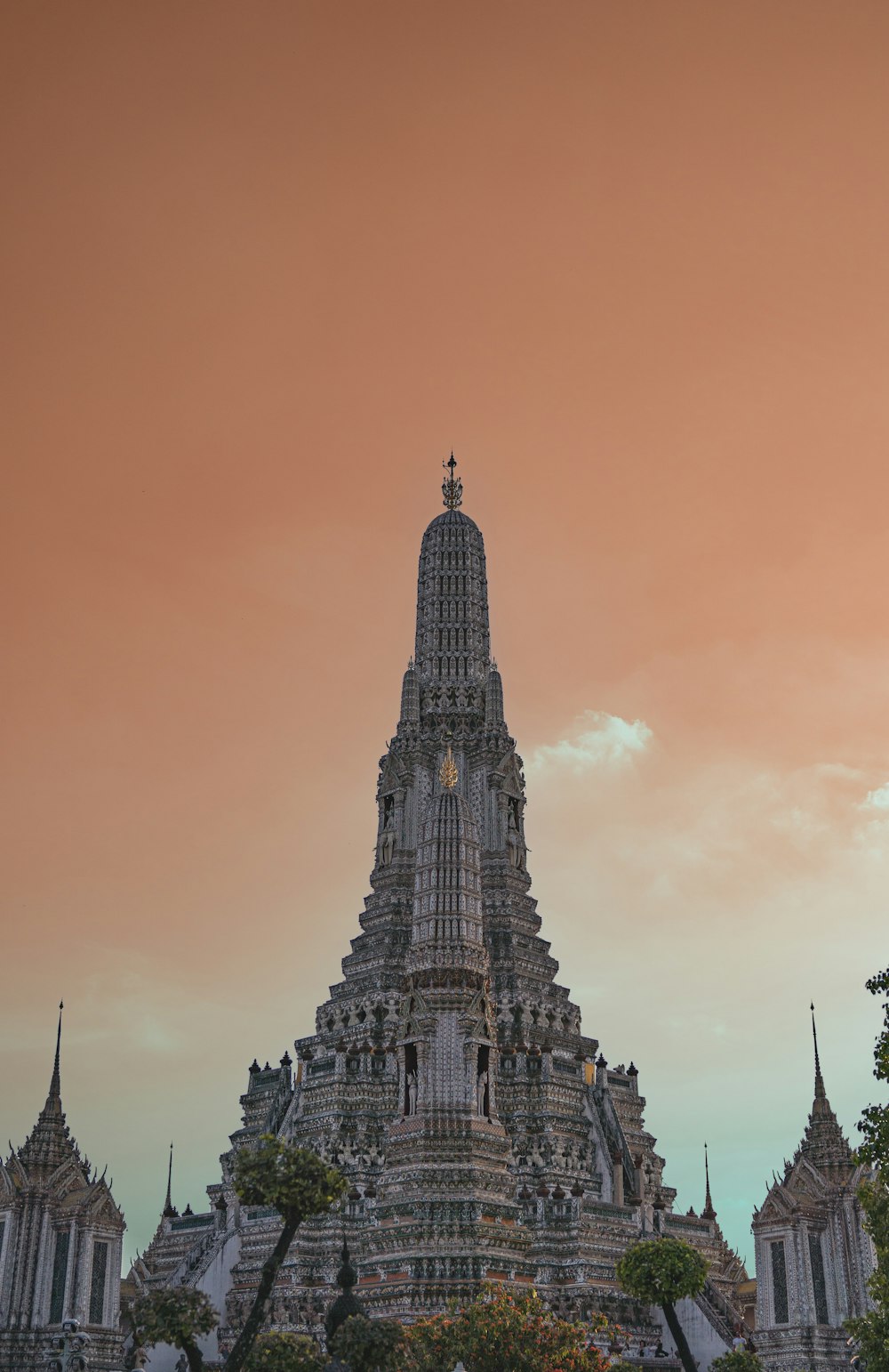 a very tall tower with a clock on it's side