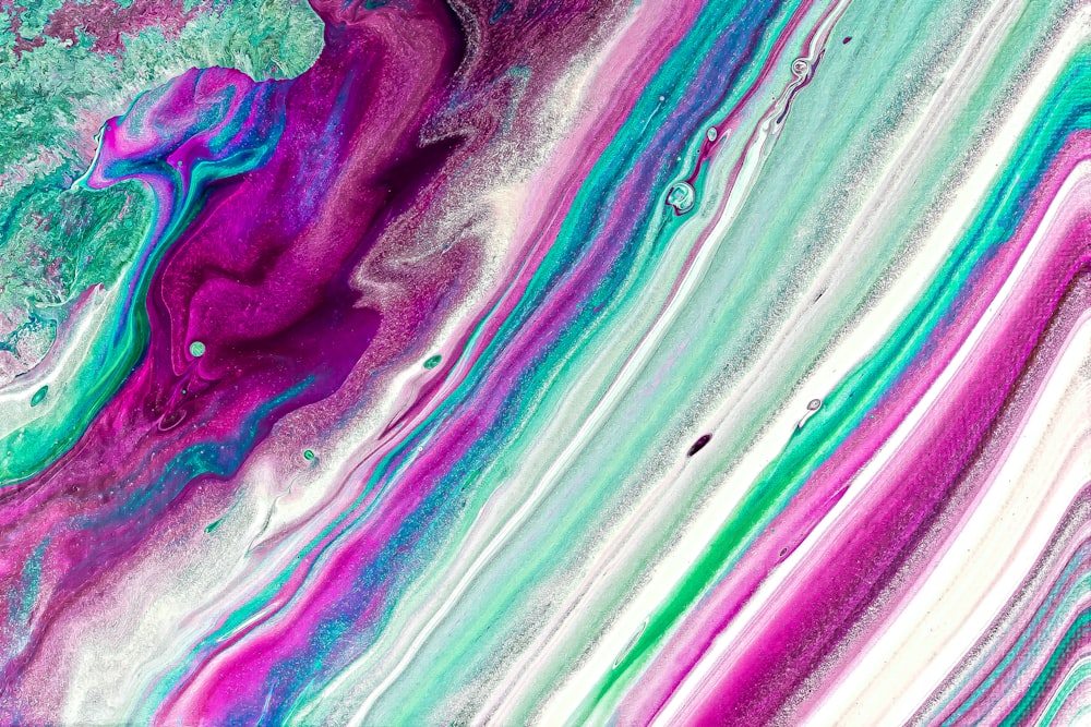 an abstract painting with purple, green and blue colors