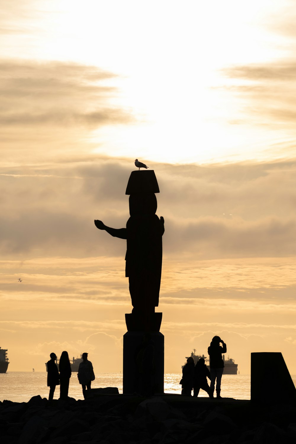 a group of people standing around a statue