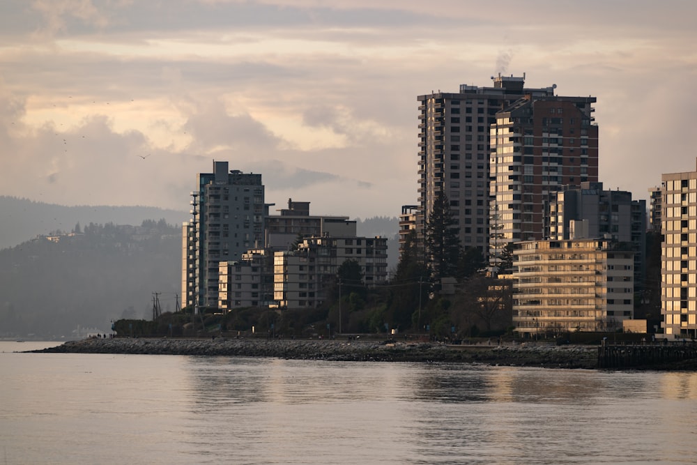 a body of water with a city in the background