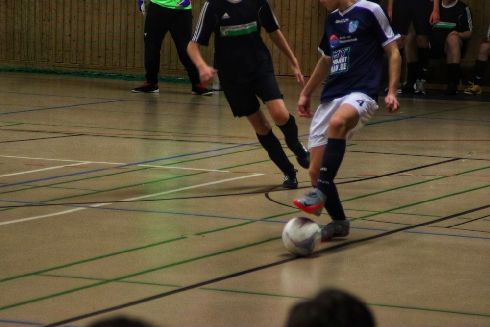 a group of young men playing a game of soccer