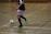 A customer wearing Footytech mini shinguards while playing football.