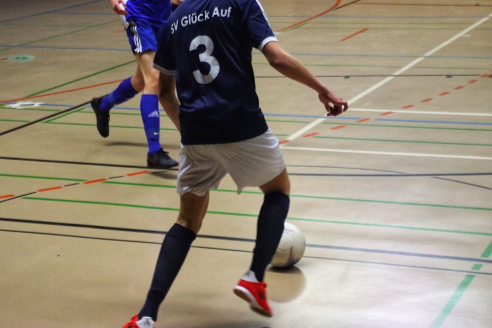 a group of young men playing a game of soccer