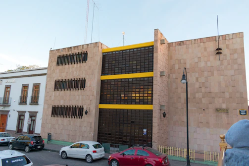 Modern commercial building with classic stone facade in Ambato.