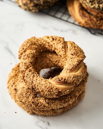 a stack of doughnuts sitting on top of a white counter