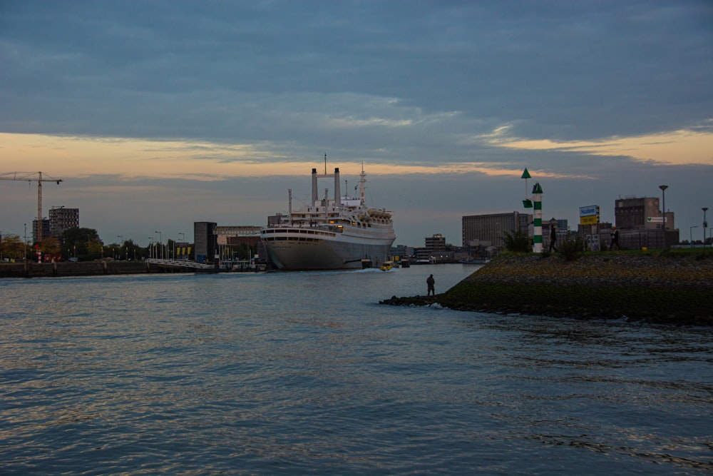 a cruise ship is docked in a harbor