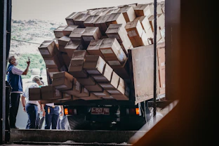 A cargo truck loaded with sealed pharmaceutical containers ready for dispatch.