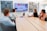 Business professionals discussing strategy around a conference table in a modern office.