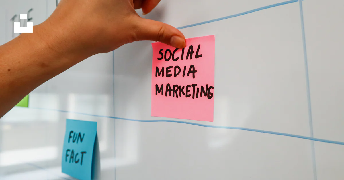A hand is writing on a sticky note photo – Free Sticky notes Image on ...