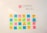 A whiteboard with colorful sticky notes arranged in a grid. Each sticky note has words related to company values, such as equality, culture, and respect. The sticky notes are pink, blue, yellow, and green, creating a vibrant and organized display.