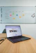Creative content being scheduled on a digital calendar on a sleek laptop.