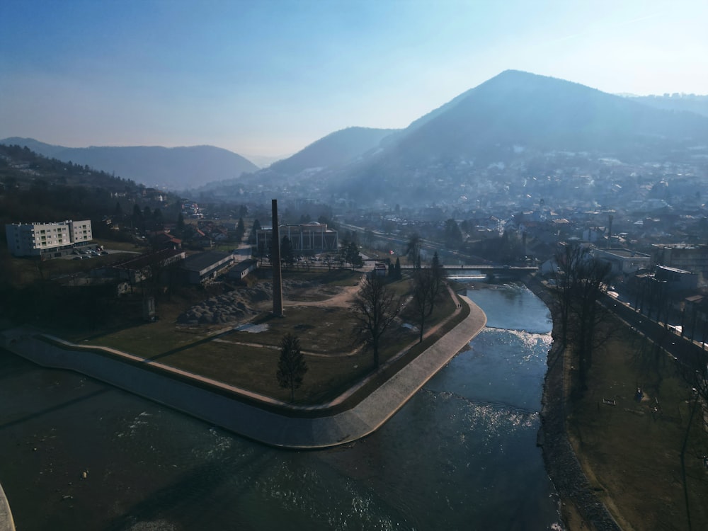 an aerial view of a river running through a city